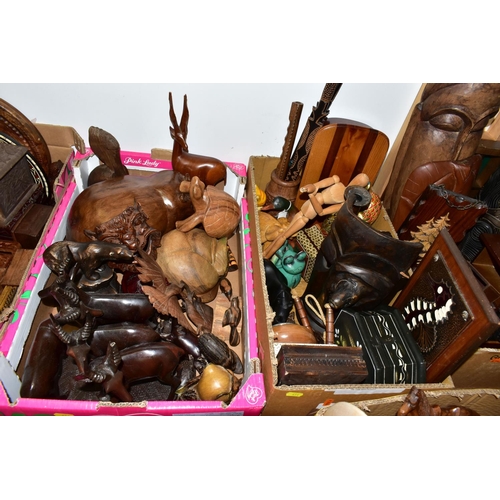 414 - EIGHT BOXES AND LOOSE TREEN, to include carved animals and birds, some painted, decorative masks and... 