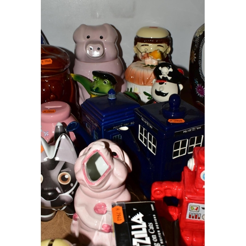 419 - A GROUP OF NOVELTY CERAMICS, to include two Tardis teapots, four Robertson jam figures, money boxes ... 