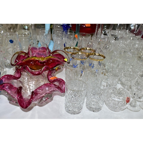 445 - A COLLECTION OF CUT CRYSTAL AND COLOURED ART GLASS, comprising a Murano clear to cranberry controlle... 