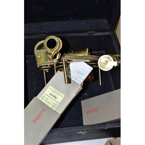 483 - A Reproduction brass Sextant in a wooden box together with an Aristo Studio slide rule (1)