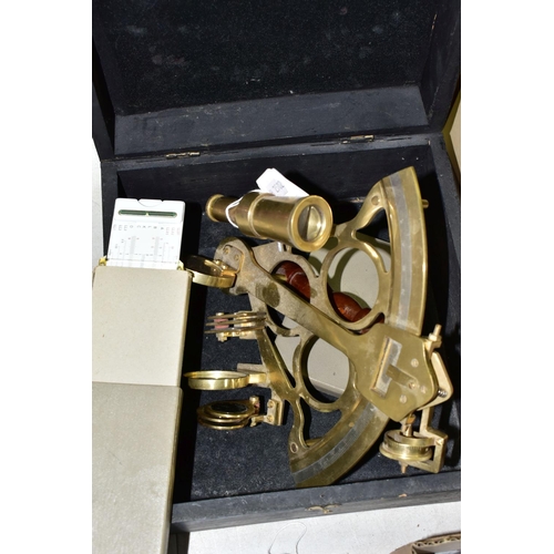 483 - A Reproduction brass Sextant in a wooden box together with an Aristo Studio slide rule (1)