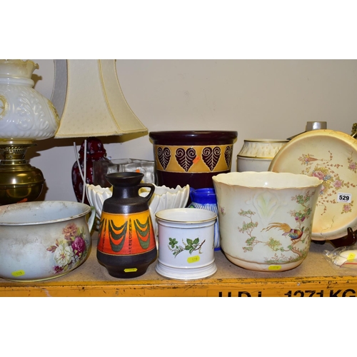 529 - A QUANTITY OF DECORATIVE CERAMICS, JARDINIERES AND LAMPS ETC, to include a German fat lava style vas... 