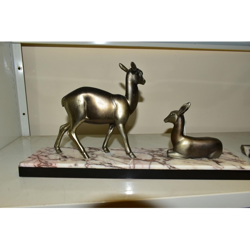 534 - A FRENCH ART DECO SCULPTURE OF TWO DEER, one lying one standing, mounted to a marble base, approxima... 