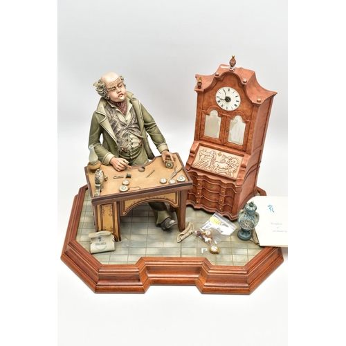 1127A - A CAPODIMONTE PORCELAIN TABLEAU 'THE CLOCK MAKER', sculpted by Mario Angela, modelled as a gentelamn... 