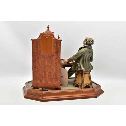 1127A - A CAPODIMONTE PORCELAIN TABLEAU 'THE CLOCK MAKER', sculpted by Mario Angela, modelled as a gentelamn... 