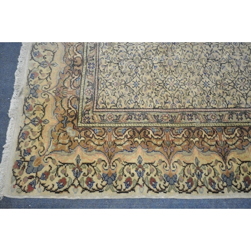 1197 - A 20TH CENTURY WOLLEN PERSIAN MOOD CARPET, with a repeating design and foliate border, 290cm x 196cm... 