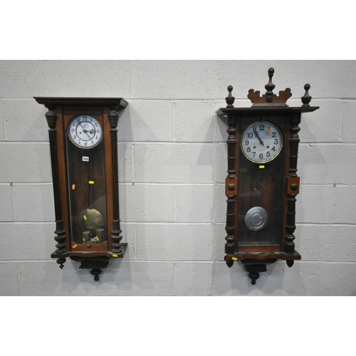 1199 - A LATE 19TH CENTURY WALNUT VIENNA WALL CLOCK, half turned fluted pillars to the door, enclosing an e... 