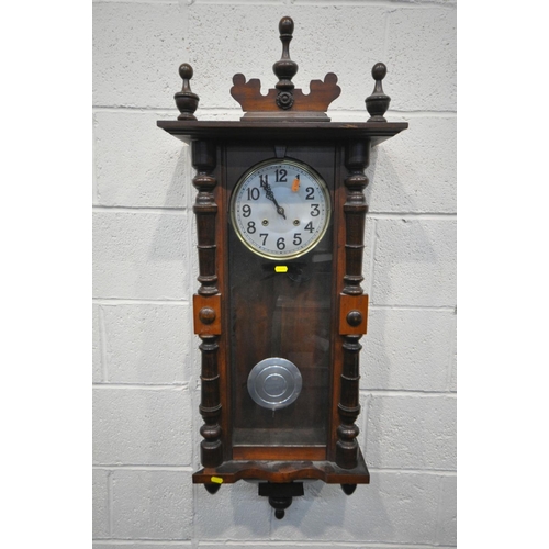 1199 - A LATE 19TH CENTURY WALNUT VIENNA WALL CLOCK, half turned fluted pillars to the door, enclosing an e... 