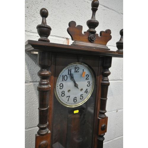 1199 - A LATE 19TH CENTURY WALNUT VIENNA WALL CLOCK, half turned fluted pillars to the door, enclosing an e... 