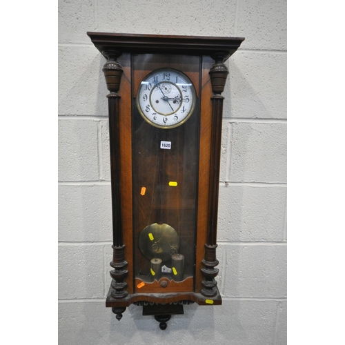 1199 - A LATE 19TH CENTURY WALNUT VIENNA WALL CLOCK, half turned fluted pillars to the door, enclosing an e... 