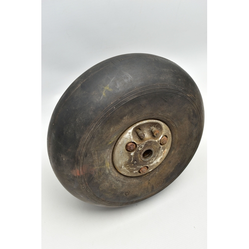 1057A - A WWII AIRCRAFT PNEUMATIC WHEEL, PROBABLY FROM A HAURRICANE OR SPITFIRE, the black rubber marked '4.... 