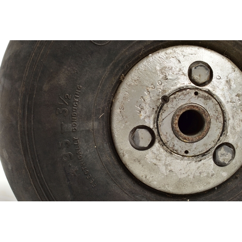 1057A - A WWII AIRCRAFT PNEUMATIC WHEEL, PROBABLY FROM A HAURRICANE OR SPITFIRE, the black rubber marked '4.... 