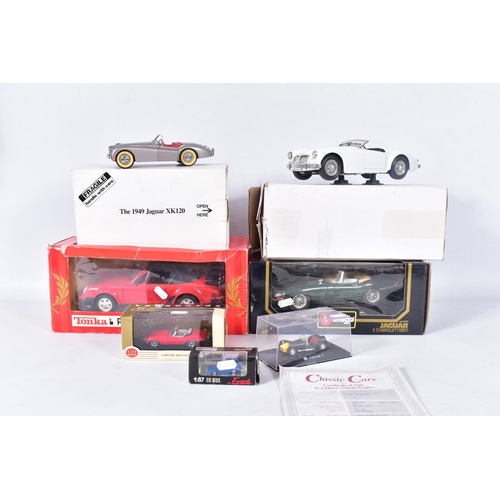 31 - A BOXED DANBURY MINT 1949 JAGUAR XK120, 1/24 scale, missing mirrors and has some yellowing to whitew... 