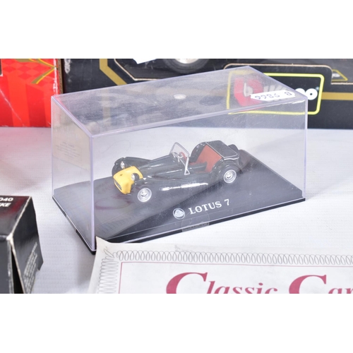 31 - A BOXED DANBURY MINT 1949 JAGUAR XK120, 1/24 scale, missing mirrors and has some yellowing to whitew... 