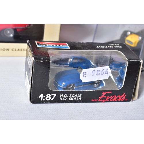 31 - A BOXED DANBURY MINT 1949 JAGUAR XK120, 1/24 scale, missing mirrors and has some yellowing to whitew... 