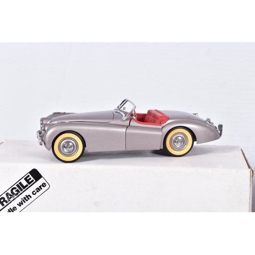 31 - A BOXED DANBURY MINT 1949 JAGUAR XK120, 1/24 scale, missing mirrors and has some yellowing to whitew... 