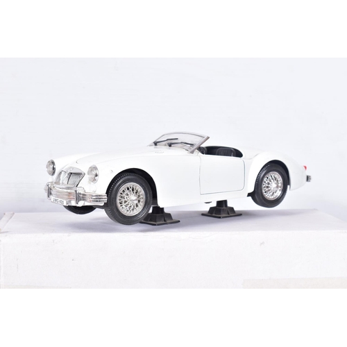 31 - A BOXED DANBURY MINT 1949 JAGUAR XK120, 1/24 scale, missing mirrors and has some yellowing to whitew... 