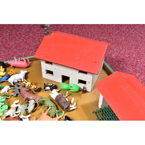 179 - A SCRATCHBUILT WOODEN FARMYARD, with a quantity of Britains and other farm and zoo animals and acces... 