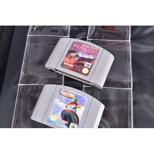 209 - TWO BOXED NINTENDO 64 CONSOLES, CONTROLLERS AND A QUANTITY OF GAMES, N64s that are boxed are not the... 