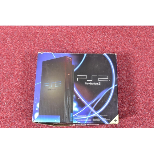 211 - TWO BOXED PLAYSTATION 2 CONSOLES AND A QUANTITY OF GAMES, one of the consoles was not the one that o... 