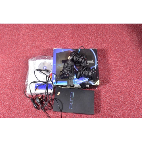 211 - TWO BOXED PLAYSTATION 2 CONSOLES AND A QUANTITY OF GAMES, one of the consoles was not the one that o... 