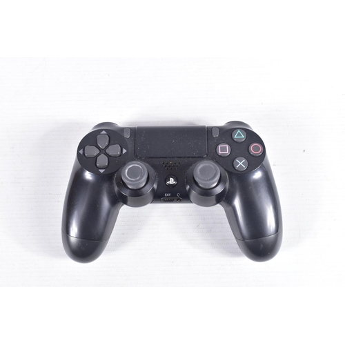 214 - A PLAYSTATION 4 SLIM CONSOLE AND CONTROLLER, console is noteably dirty, but is in working condition ... 