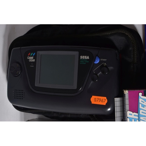 219 - A SEGA GAME GEAR, AND QUANTITY OF GAMES, games include Sonic The Hedgehog, Super Space Invaders, Shi... 