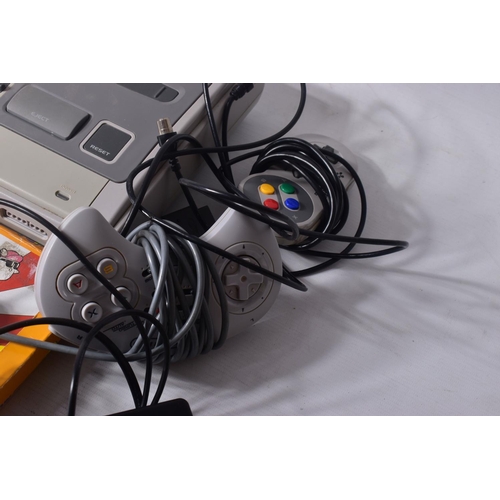 221 - SNES CONSOLE AND QUANTITY OF GAMES, games include Super Mario World, Super Mario All Stars, Street F... 