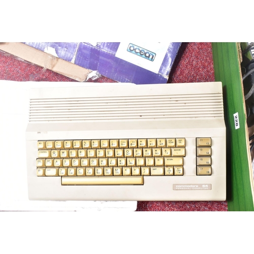 228 - A BOXED COMMODORE 64 (C64 MODEL), ACCESSORIES AND A QUANTITY OF GAMES, accessories include a dataset... 