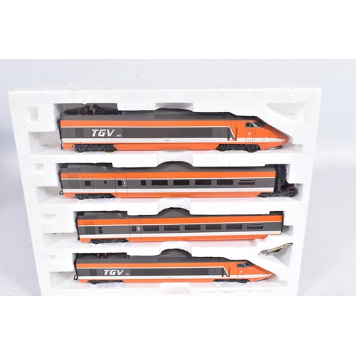 260 - A BOXED LIMA GOLDEN SERIES HO GAUGE S.N.C.F. TGV FOUR CAR SET, No.149711GP, with three boxed additio... 