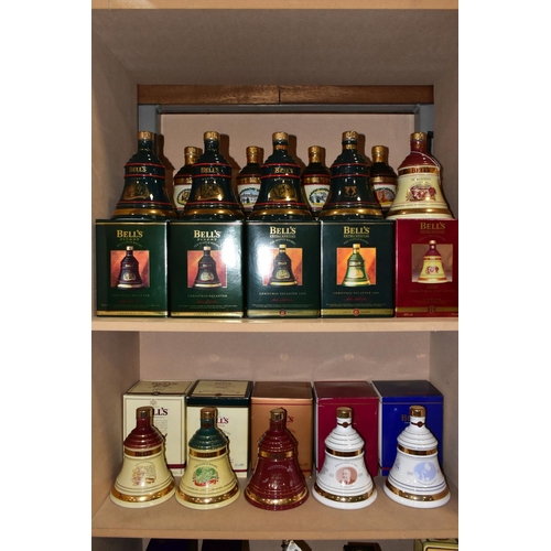 305 - BELL'S WHISKY_ 'CHRISTMAS DECANTERS' fourteen  Porcelain Decanters of Bell's Extra Special Old Scotc... 