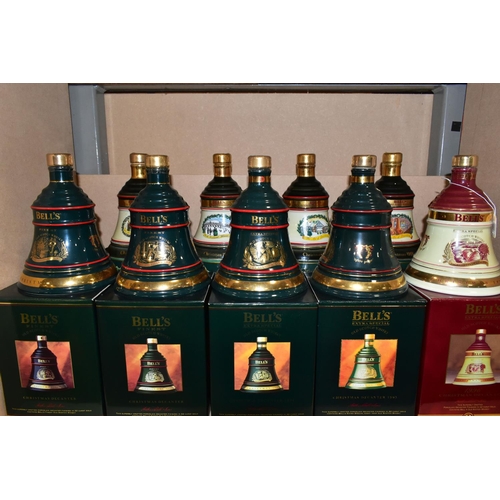 305 - BELL'S WHISKY_ 'CHRISTMAS DECANTERS' fourteen  Porcelain Decanters of Bell's Extra Special Old Scotc... 