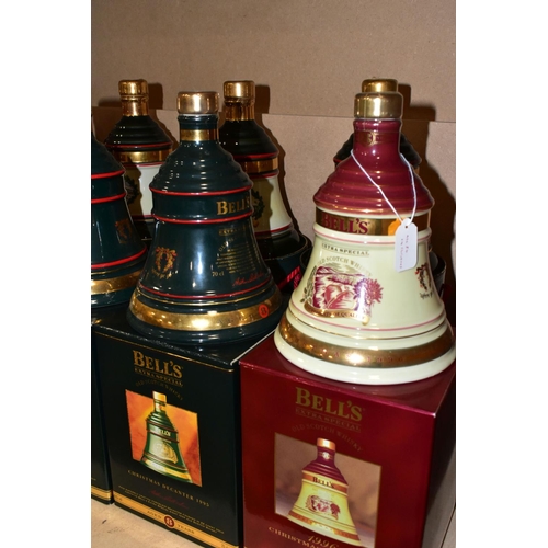 305 - BELL'S WHISKY_ 'CHRISTMAS DECANTERS' fourteen  Porcelain Decanters of Bell's Extra Special Old Scotc... 