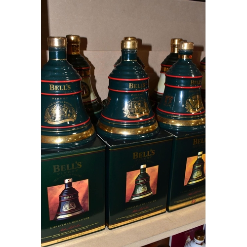 305 - BELL'S WHISKY_ 'CHRISTMAS DECANTERS' fourteen  Porcelain Decanters of Bell's Extra Special Old Scotc... 