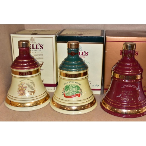 305 - BELL'S WHISKY_ 'CHRISTMAS DECANTERS' fourteen  Porcelain Decanters of Bell's Extra Special Old Scotc... 