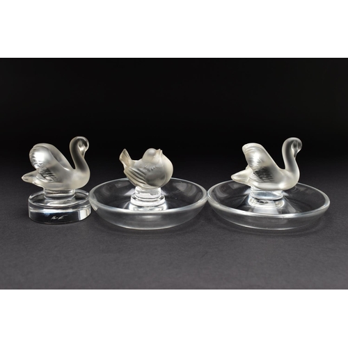 101 - TWO LALIQUE RING / PIN TRAYS AND A LALIQUE PAPERWEIGHT, the two clear glass ring trays with a froste... 