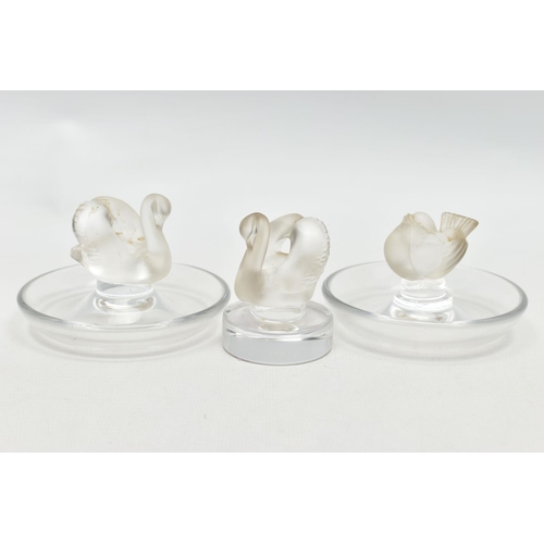 101 - TWO LALIQUE RING / PIN TRAYS AND A LALIQUE PAPERWEIGHT, the two clear glass ring trays with a froste... 