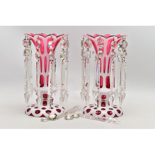 102 - A PAIR OF LATE 19TH CENTURY CRANBERRY AND WHITE OVERLAID LUSTRES, frilled rim over oval and circular... 