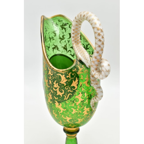 106 - A PAIR OF 19TH CENTURY BOHEMIAN GREEN AND GILT GLASS PEDESTAL EWERS OF HELMET FORM, each with a whit... 