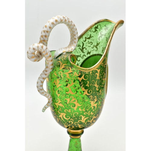 106 - A PAIR OF 19TH CENTURY BOHEMIAN GREEN AND GILT GLASS PEDESTAL EWERS OF HELMET FORM, each with a whit... 