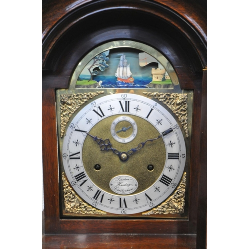 225 - SINCLAIR HARDING OF CHELTENHAM, A MAHOGANY LONGCASE CLOCK, the hood with a brass finial, cylindrical... 