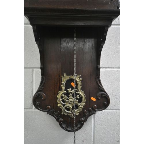 226 - A 19TH CENTURY DUTCH OAK WALL CLOCK, the arched glazed door enclosing a 10 inch painted dial with la... 