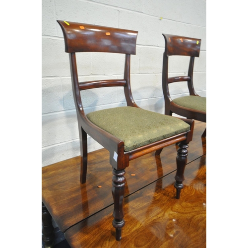 227 - A REGENCY FLAME MAHOGANY DINING TABLE, on eight turned legs with large brass caps and casters, break... 