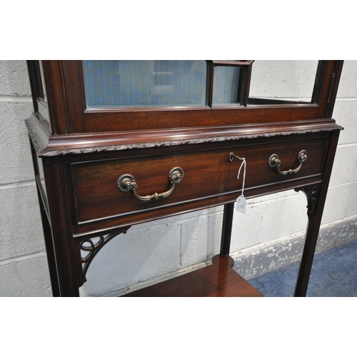 228 - A LIBERTY OF LONDON EDWARDIAN MAHOGANY DISPLAY CABINET, the single astragal glazed door enclosing a ... 