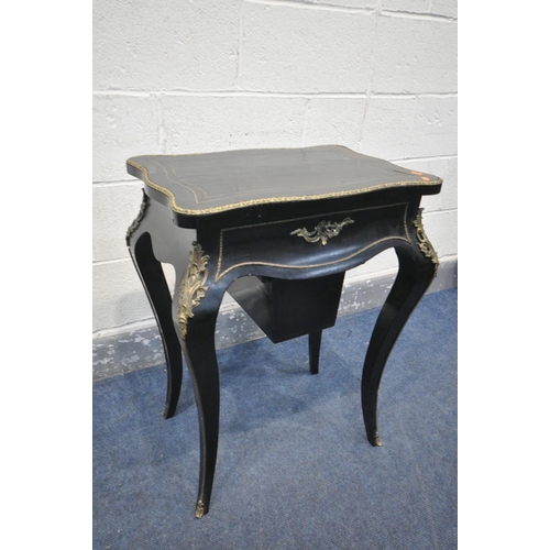 231 - A NAPOLEON III EBONISED AND GILT SERPENTINE WORK TABLE, the hinged top enclosing a rosewood interior... 