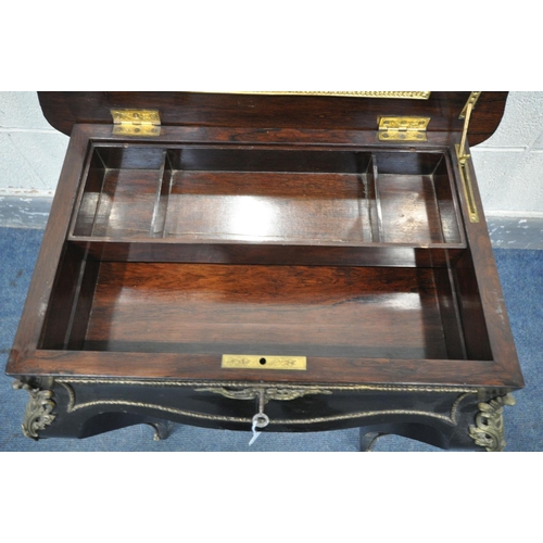 231 - A NAPOLEON III EBONISED AND GILT SERPENTINE WORK TABLE, the hinged top enclosing a rosewood interior... 