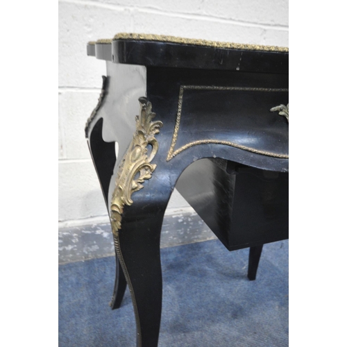 231 - A NAPOLEON III EBONISED AND GILT SERPENTINE WORK TABLE, the hinged top enclosing a rosewood interior... 