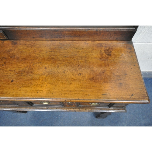 233 - A GEORGE III OAK DRESSER, the top with an arrangement of shelving, and a single drawer, over a base ... 