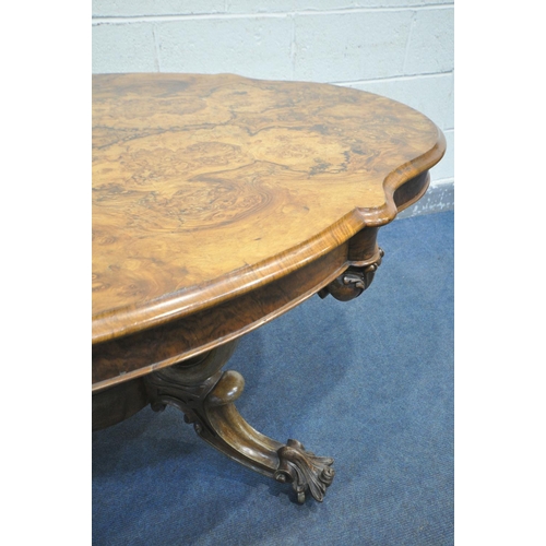 244 - A VICTORIAN BURR WALNUT CENTRE TABLE, the wavy top that's quarter veneered with a moulded edge, on a... 