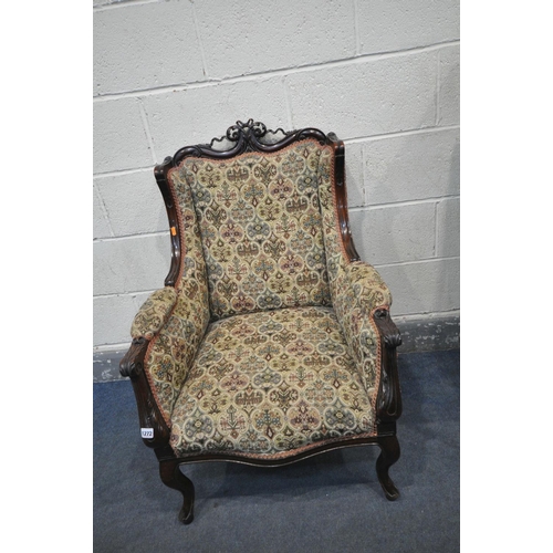 248 - A 20TH CENTURY FRENCH STYLE MAHOGANY WING BACK ARMCHAIR, scrolled surmount to swept armrests, on cab... 